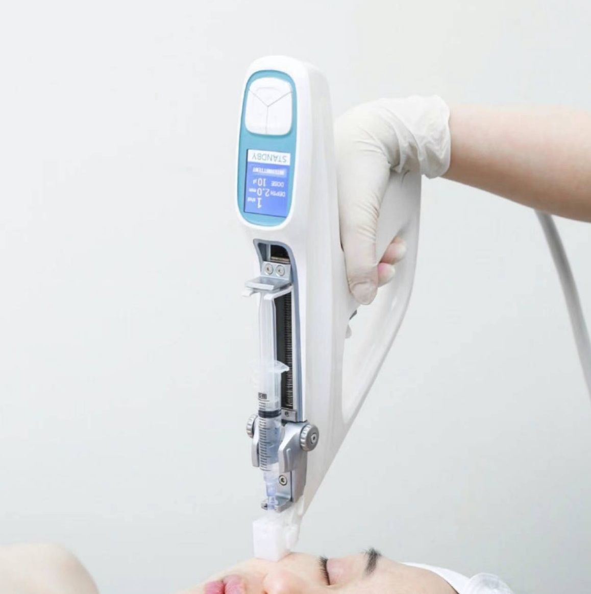 A woman is getting a facial treatment with a machine