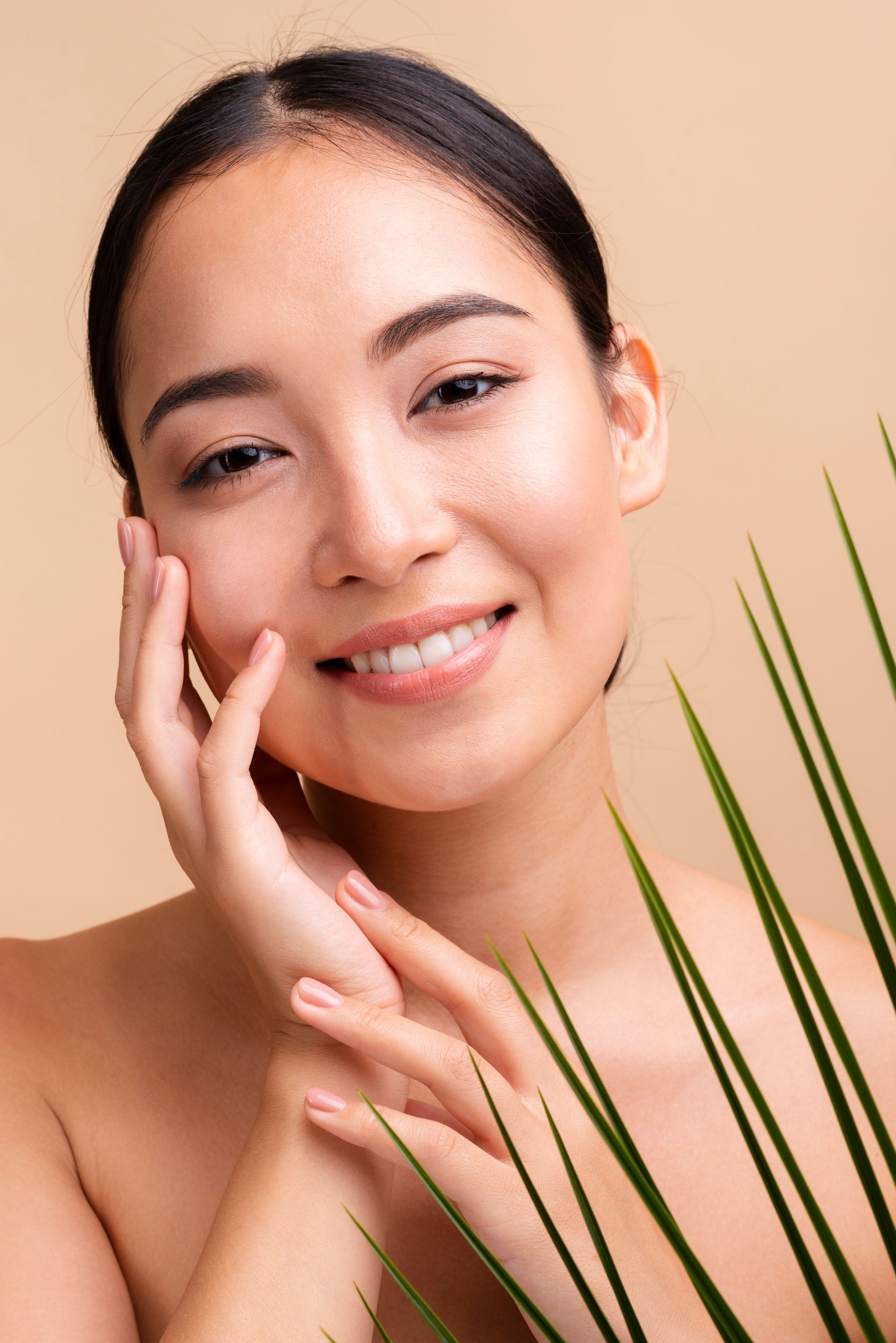 woman smiling touching cheeks