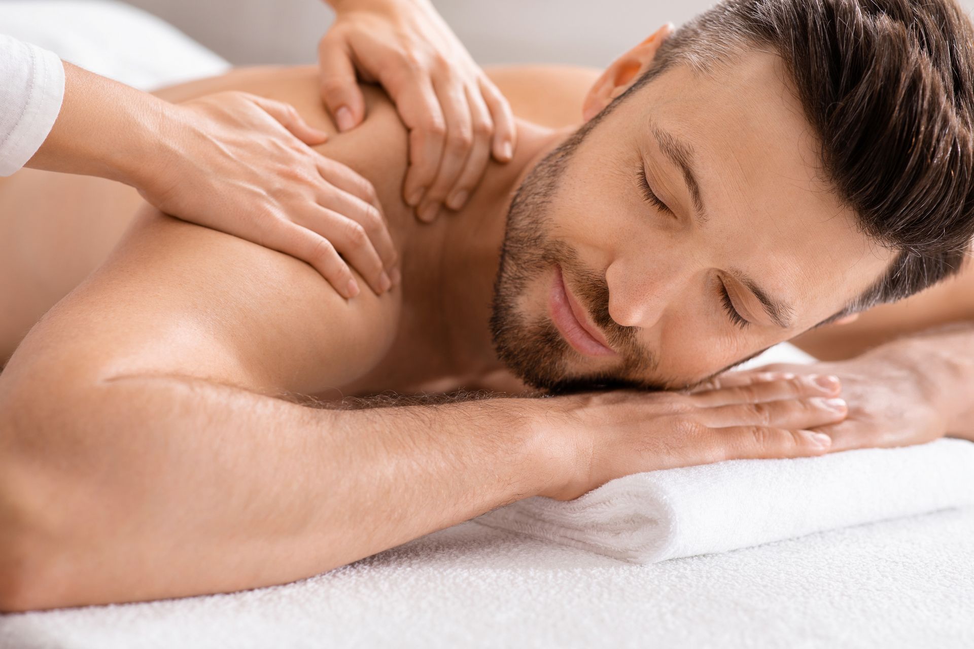 A man is getting a massage at a spa.