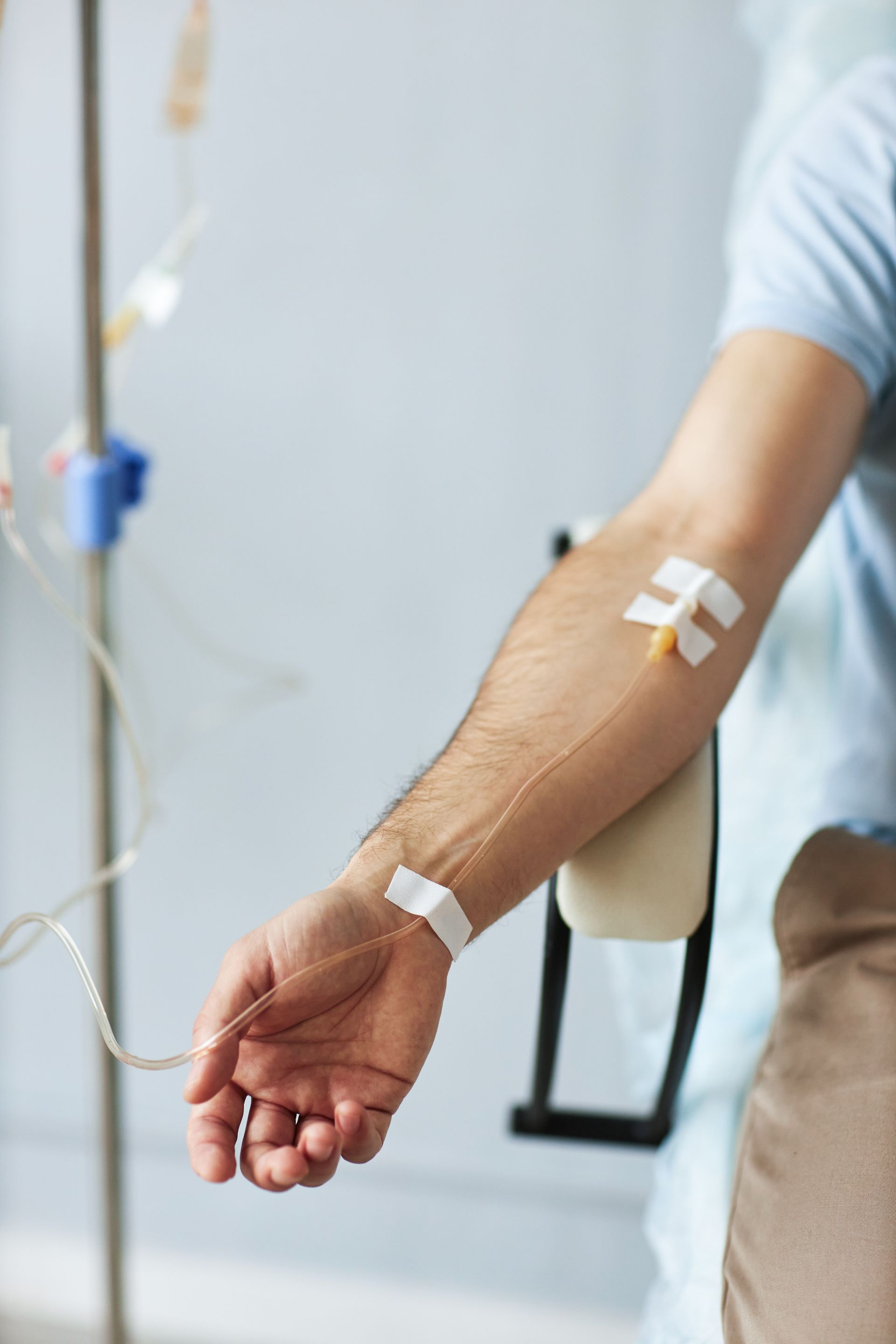 A man is getting an injection in his arm.