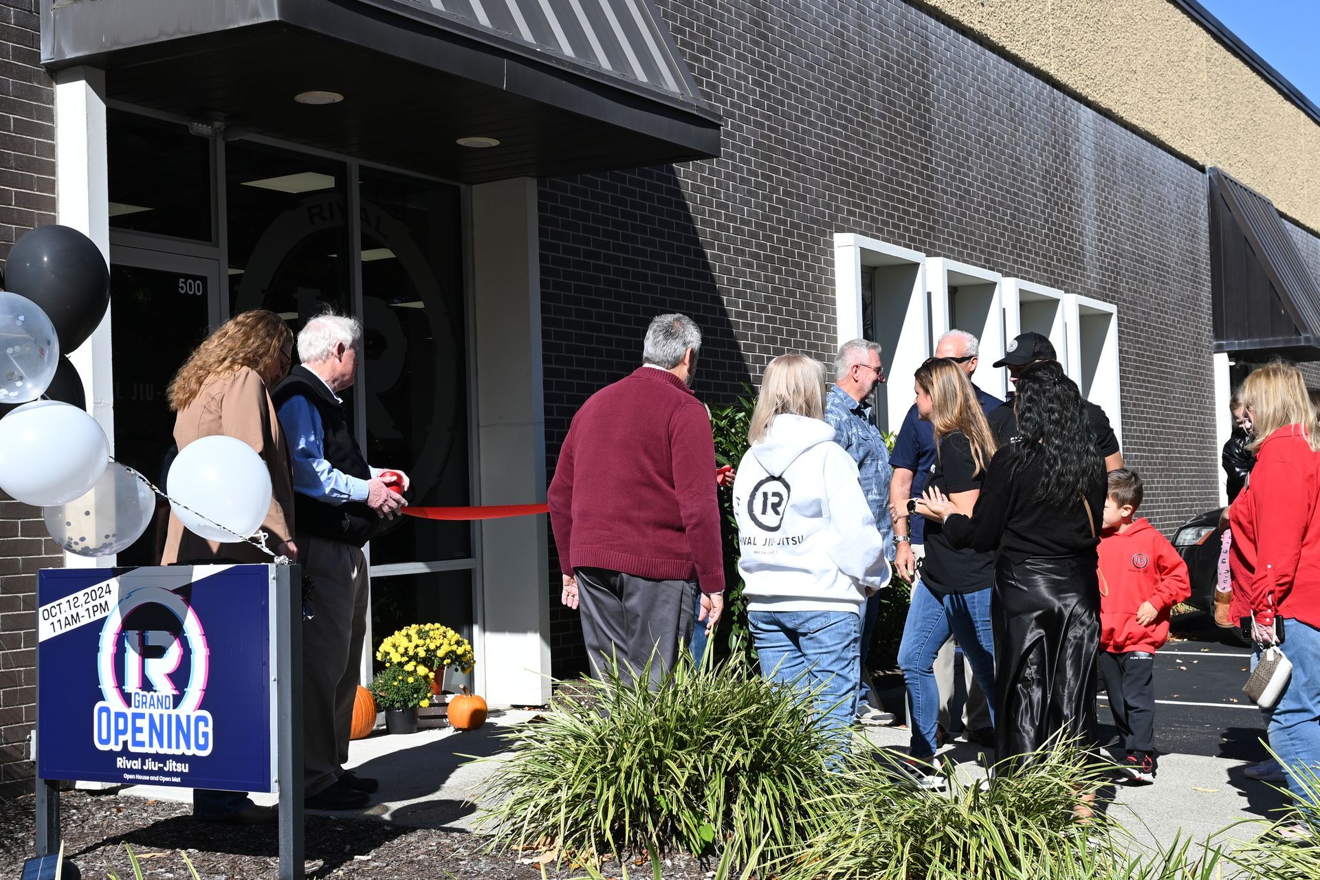 Adults practicing Brazilian Jiu-Jitsu self-defense techniques at Rival Jiu-Jitsu studio in Waldwick.