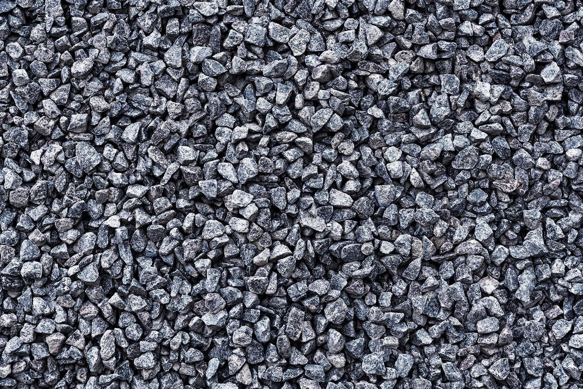 A close up of a pile of black gravel.