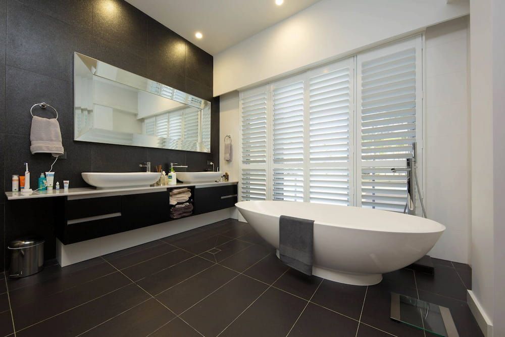 A Bathroom with A Large Tub and Two Sinks — Douglass Blinds & Security Screens in Crookwell, NSW