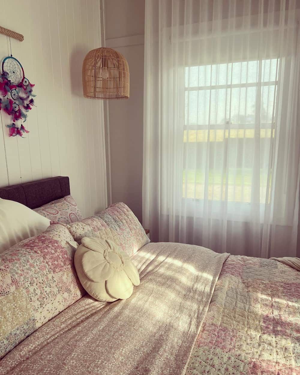 A Bedroom with A Bed, a Dream Catcher and A Window — Douglass Blinds & Security Screens in Yass, NSW