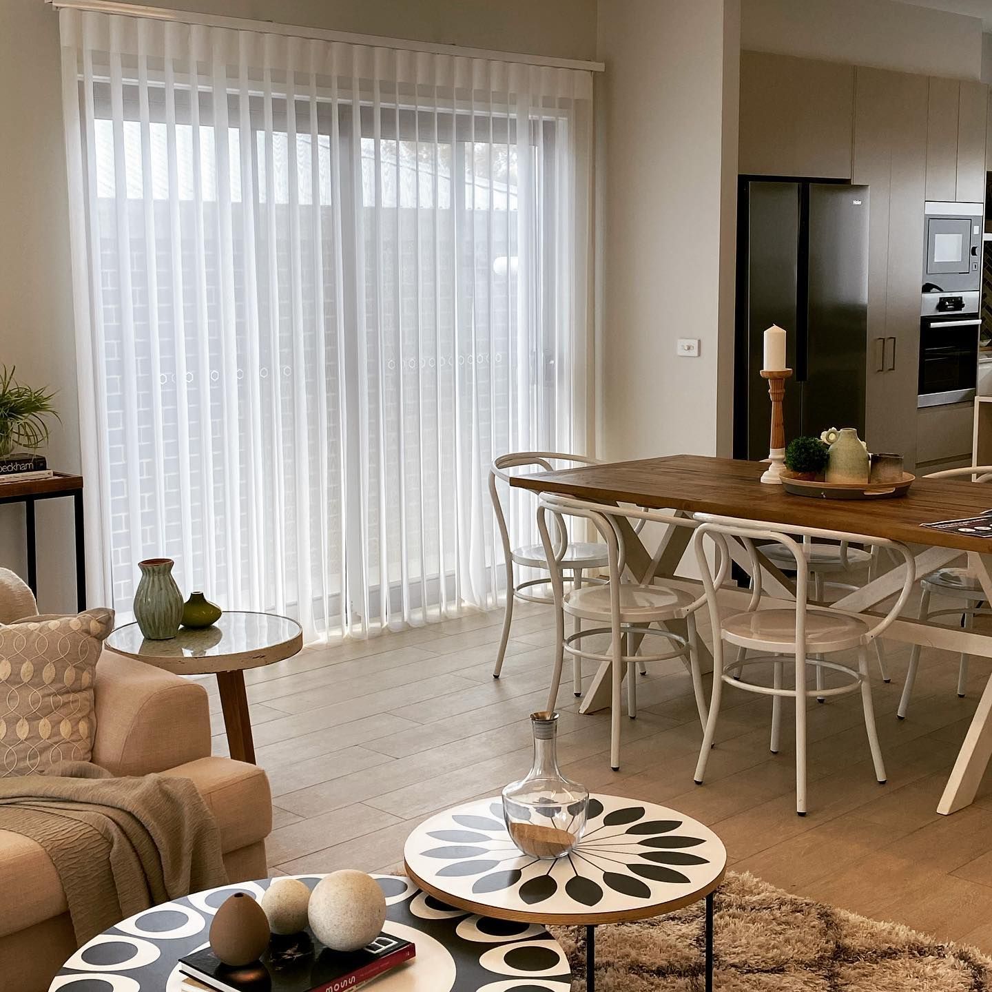 A Dining Room with Curtains over the Window — Douglass Blinds & Security Screens in Goulburn, NSW