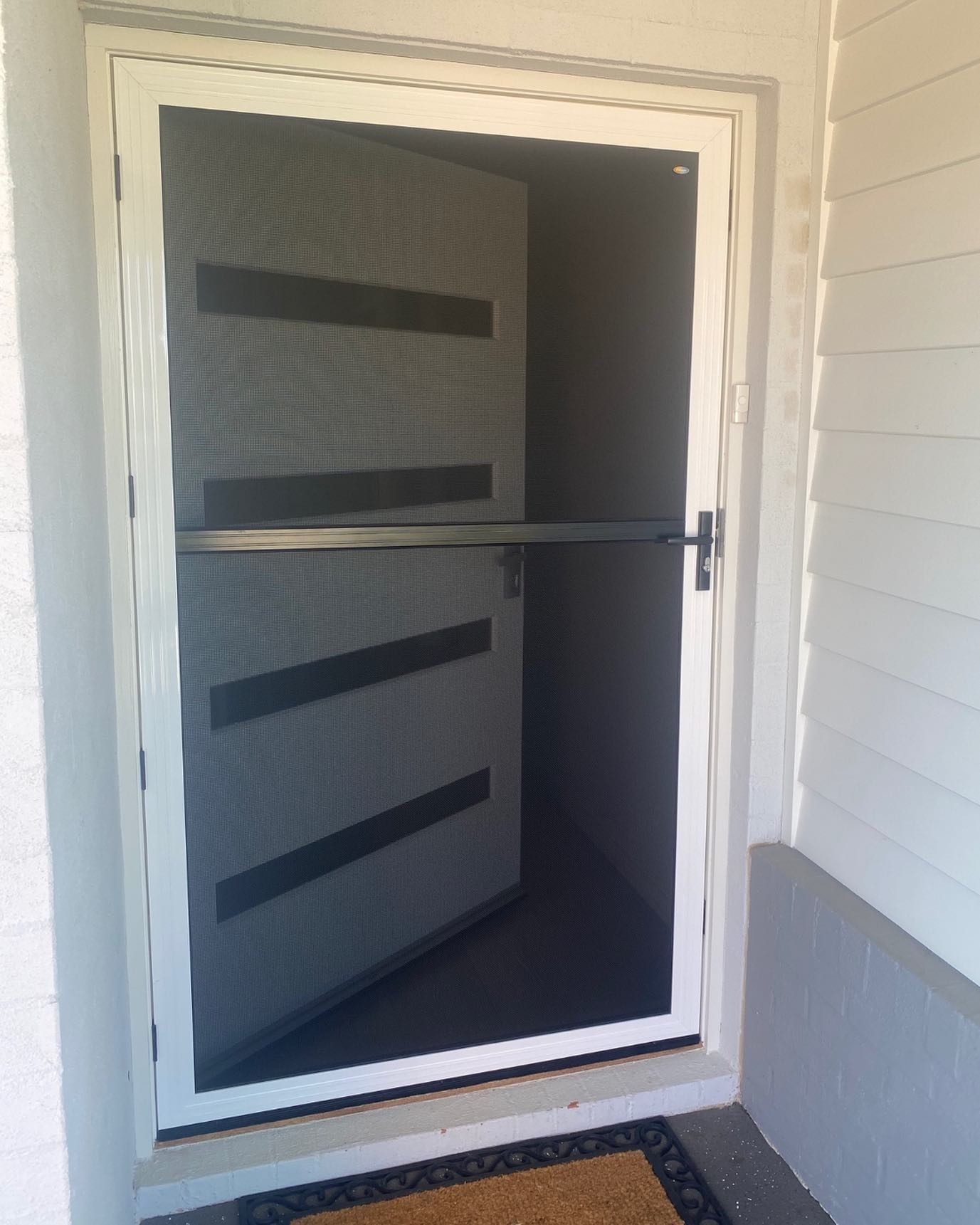 A House with a Screen Door over the Front Door — Douglass Blinds & Security Screens in Goulburn, NSW