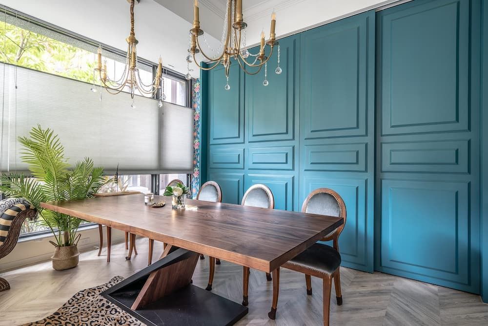 A Dining Room With a Wooden Table and Chairs With Blinds — Douglass Blinds & Security Screens in Goulburn, NSW