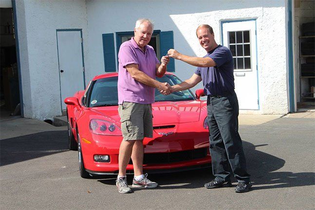 Handover of car key - Auto Body Repair & Painting in Southampton, PA