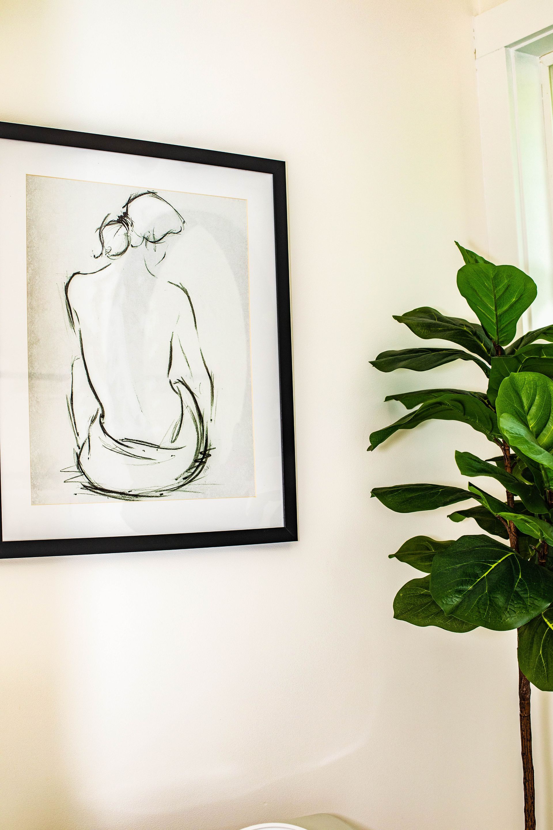 Beautiful bathroom decor in the Pilates by Eve guest restroom for clients while in the studio.