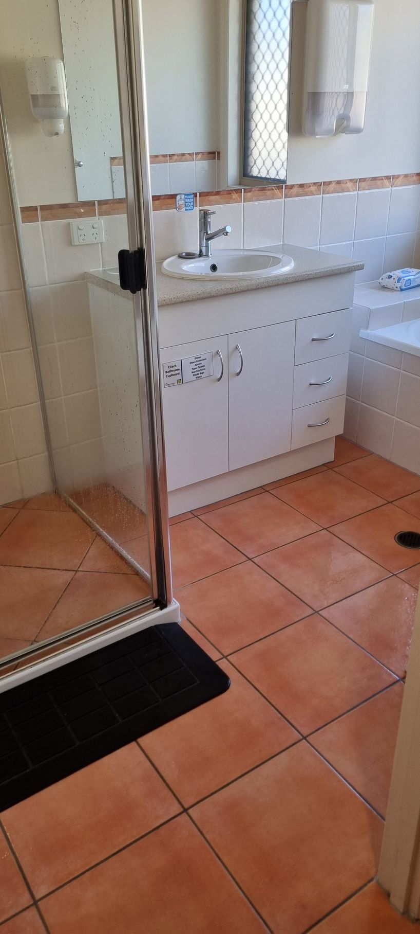 Bathroom With a White Vanity, Sink, and Shower — RWM Cleaning in Deception Bay, QLD