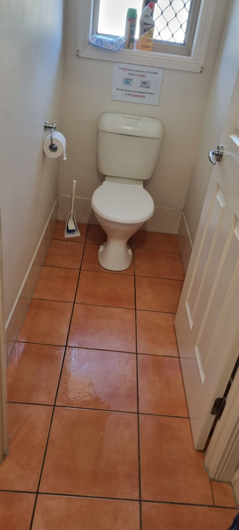 Narrow Bathroom With Toilet, Paper Roll and Brush — RWM Cleaning in Deception Bay, QLD