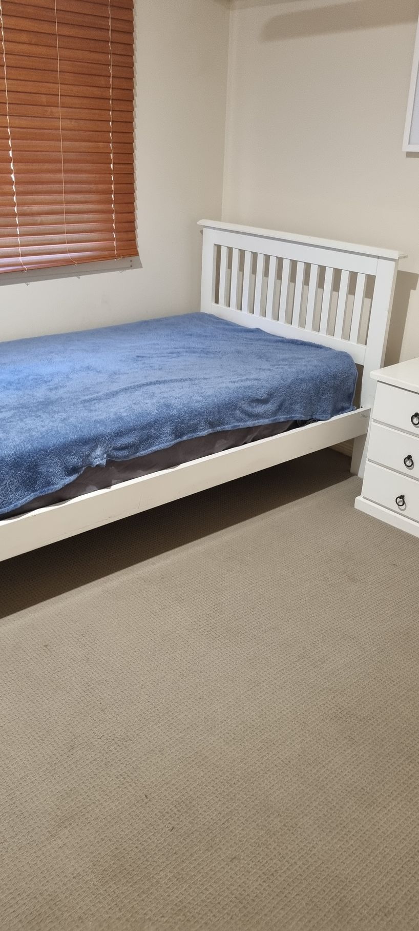 A Bedroom With a White Bed and a Blue Bedspread — RWM Cleaning in Deception Bay, QLD