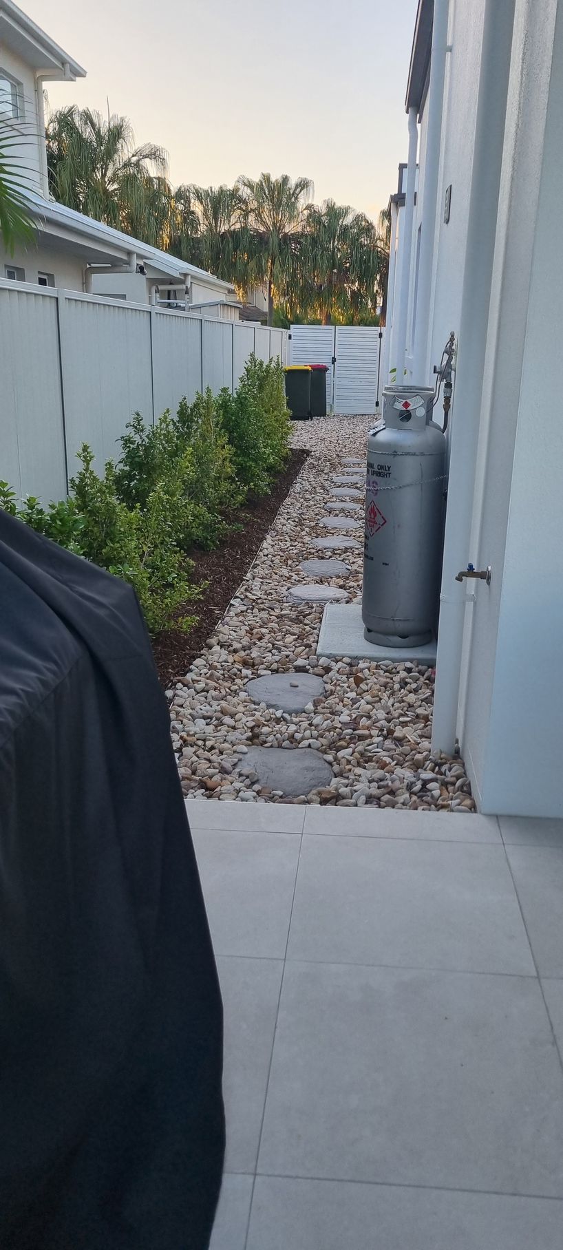 A Narrow Backyard Walkway With Stone Path — RWM Cleaning in Deception Bay, QLD