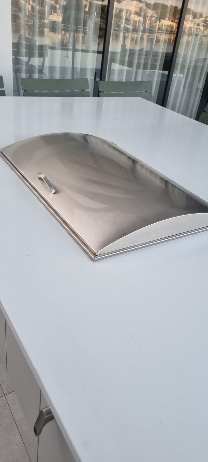 Stainless Steel Appliance Cover on a White Table — RWM Cleaning in Deception Bay, QLD