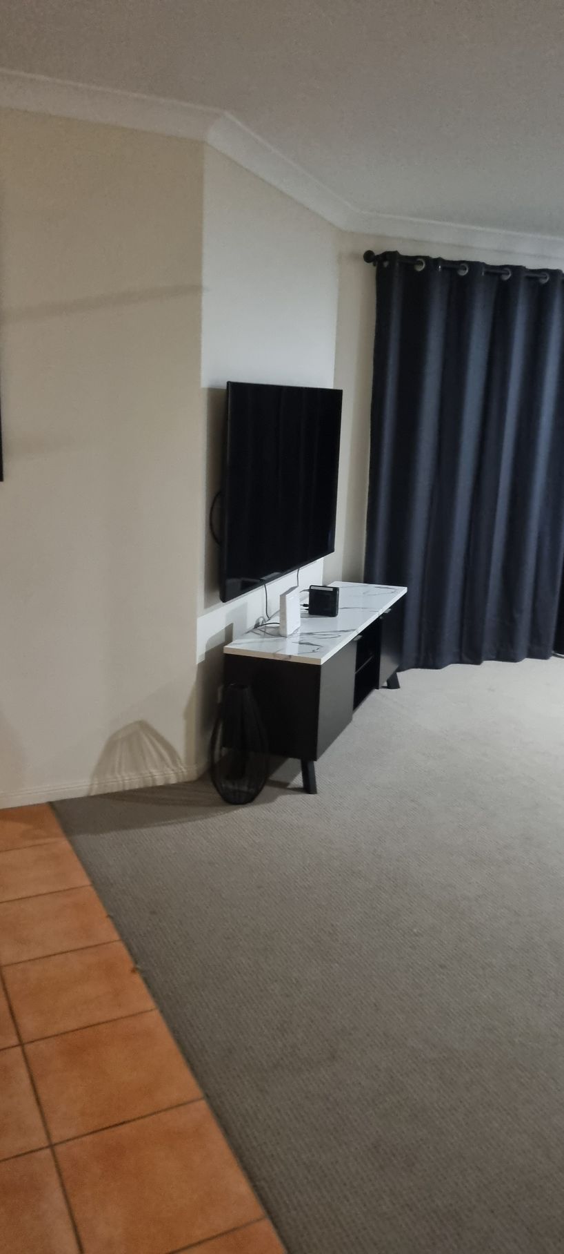 Living Room With a Mounted TV — RWM Cleaning in Deception Bay, QLD