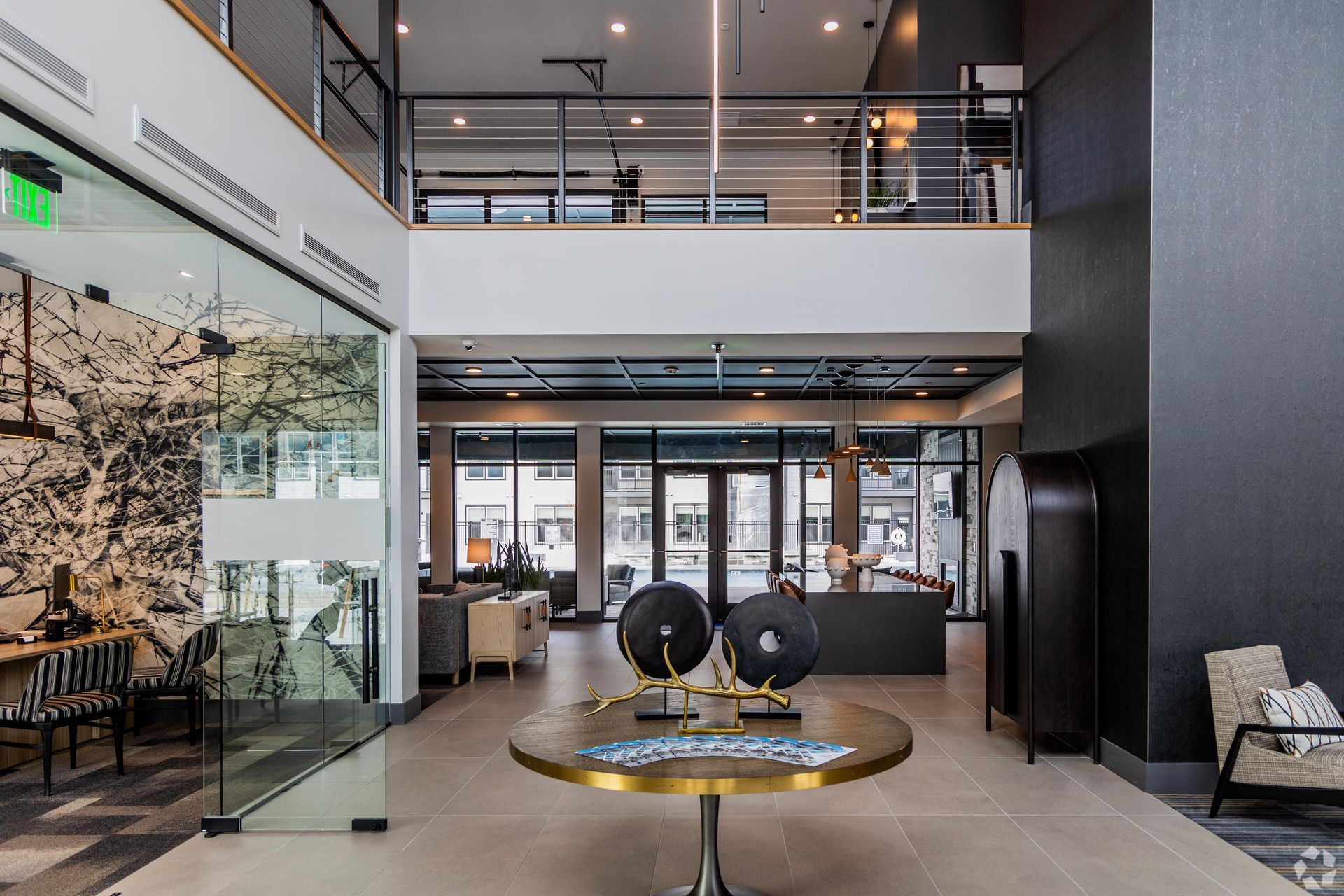 Modern lobby with seating, art, and a two-story design.