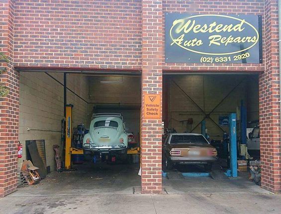 A Brick Building With A Sign That Says Westend Auto Repairs — Westend Auto Repairs in Bathurst, NSW