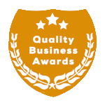 Gold shield logo for "Quality Business Awards," with white text and stars, and a laurel wreath.