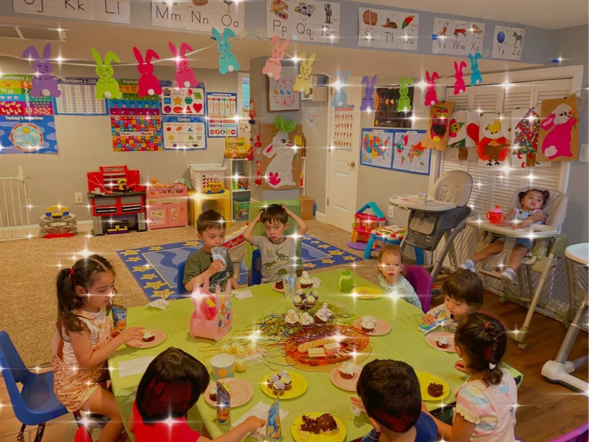 Children at a table in a decorated room, eating. Easter decorations and toys are visible.
