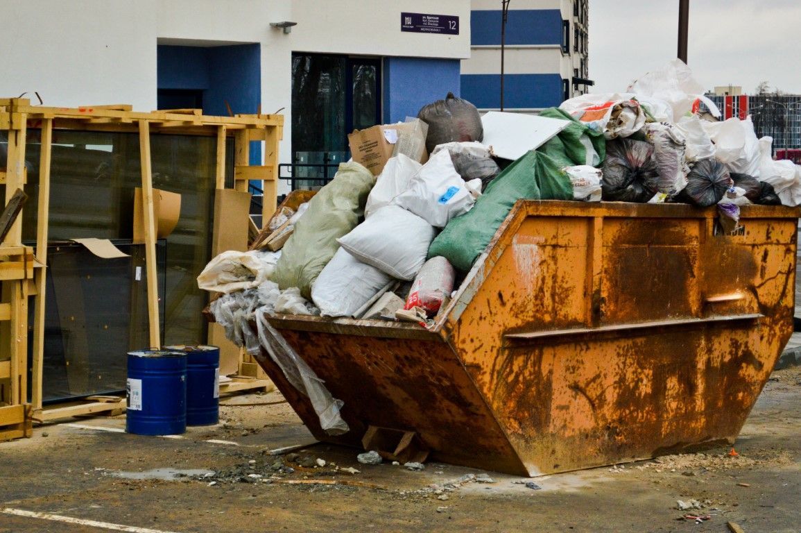 man taking out garbage