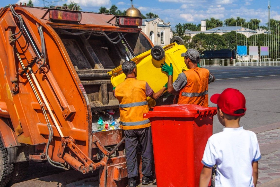 man taking out garbage