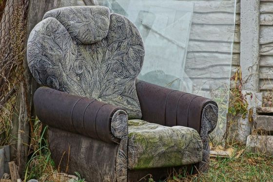 couch and junk on curb