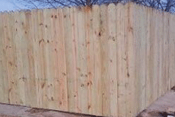 Wooden privacy fence, light brown, outdoors.