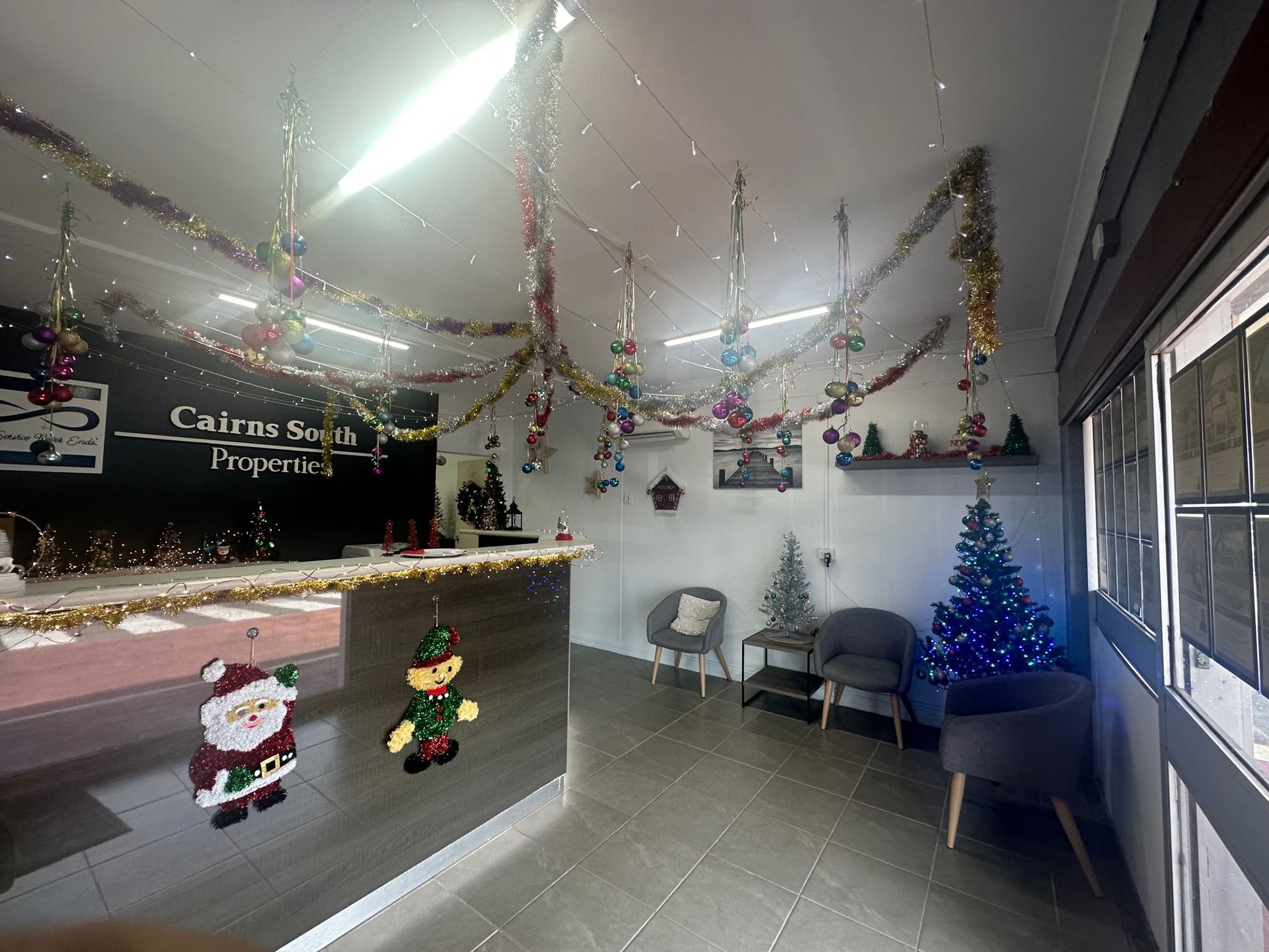 A Room With a Christmas Tree and Decorations on the Ceiling — Cairns South Properties In Edmonton, QLD
