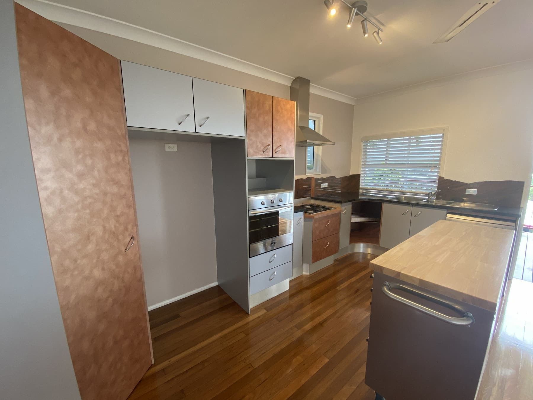 A Kitchen With Wooden Floors — Cairns South Properties In Edmonton, QLD
