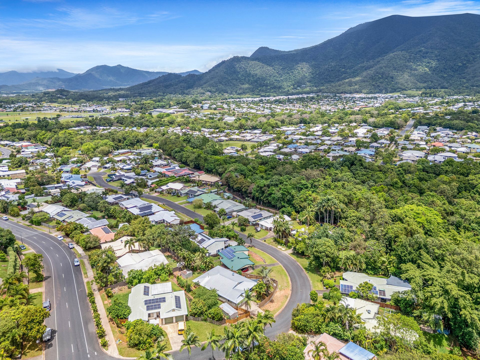 A Patio With A Table And Chairs And A Grill — Cairns South Properties In Edmonton, QLD