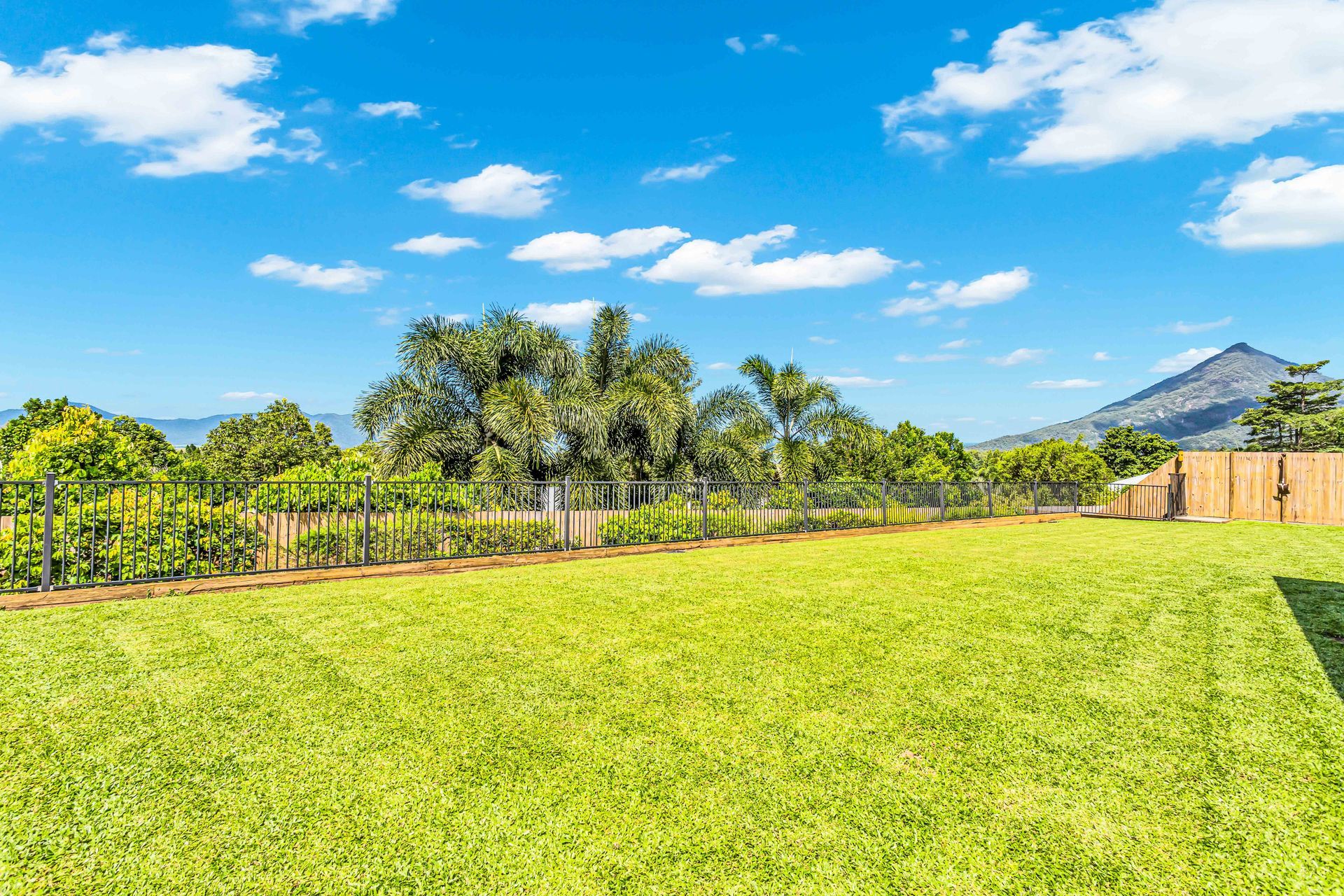 A Kitchen With A Table And Chairs And A Ceiling Fan — Cairns South Properties In Edmonton, QLD