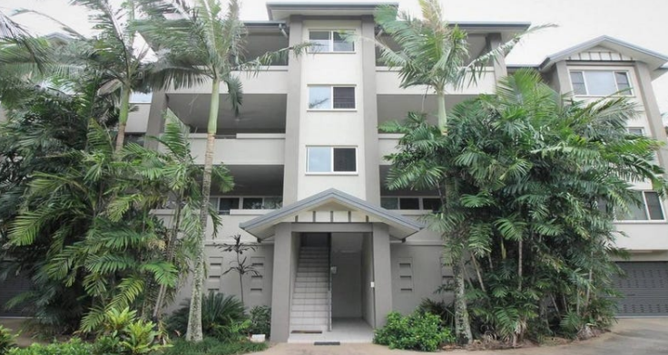 Multi-story Apartment Building With Balconies, Palm Trees — Cairns South Properties In Edmonton, QLD