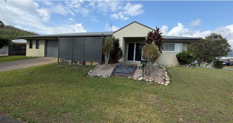 Single-story Beige House With a Dark Gray Carport and Driveway — Cairns South Properties In Edmonton, QLD