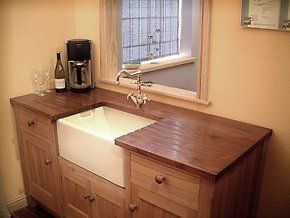 Traditional wooden cabinets with white sink
