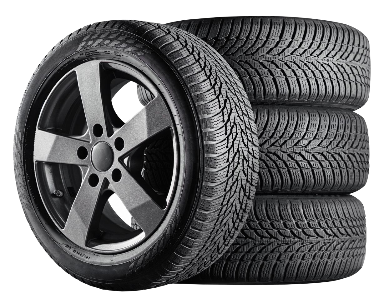 A single car wheel with a dark gray five-spoke rim leaning against a stack of three black tires with winter tread patterns.