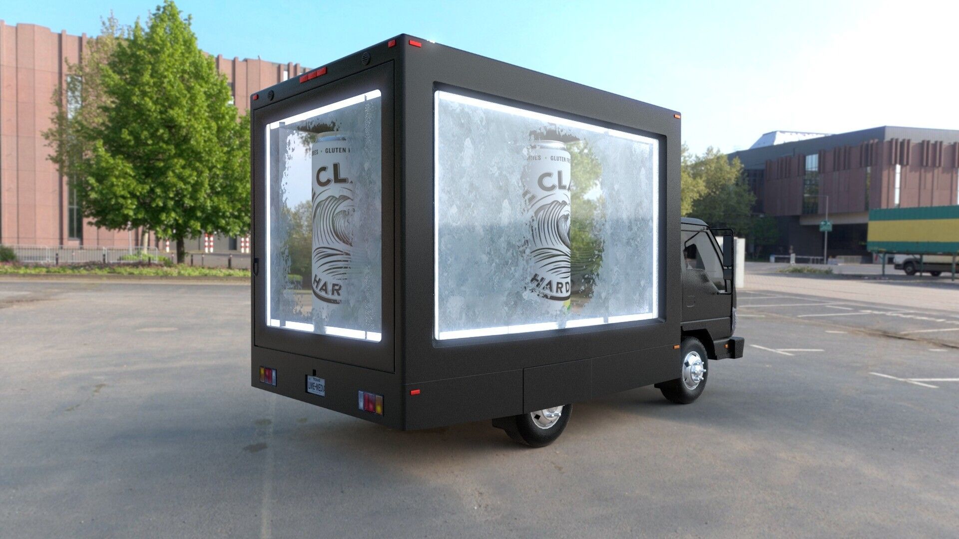 A black truck with a large screen on the back is parked in a parking lot.