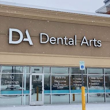 The front of a dental arts office in the snow.