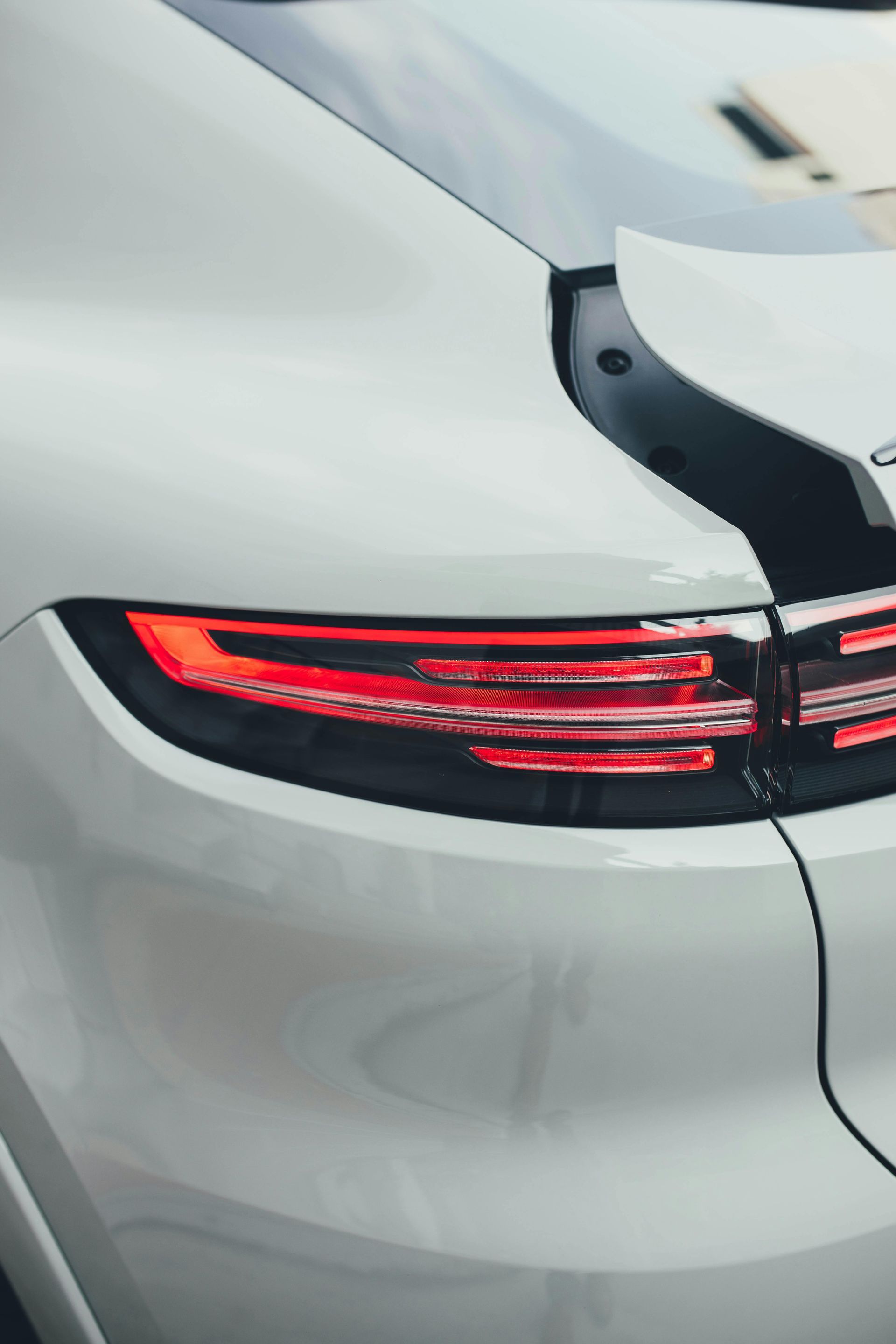 White Porsche Cayenne tail light illuminated.