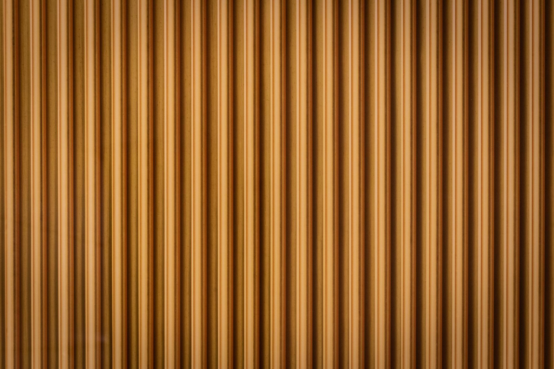 Vertical corrugated brown wall.