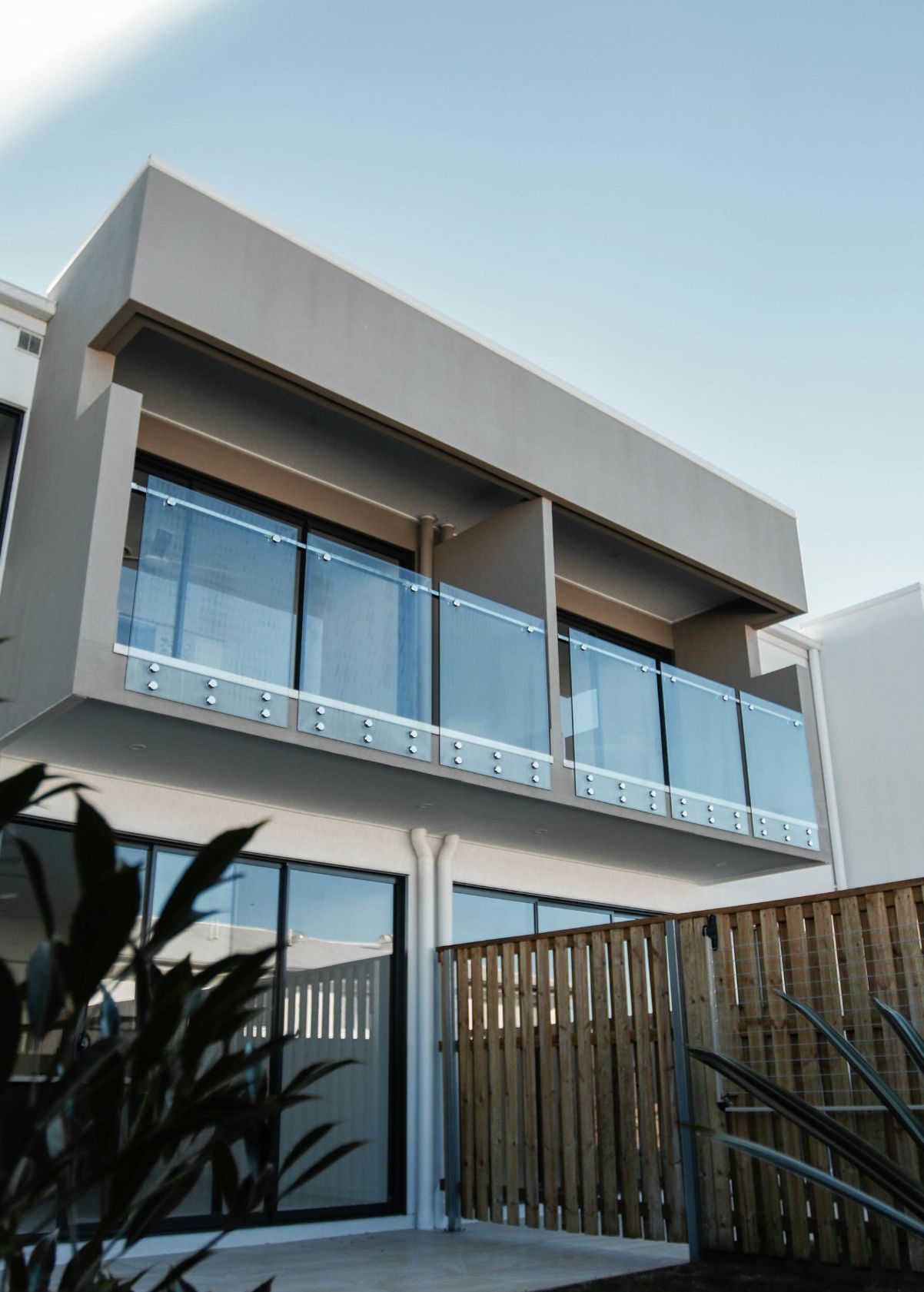 A House With a Balcony and a Wooden Fence — DC Fencing In Wondunna, QLD