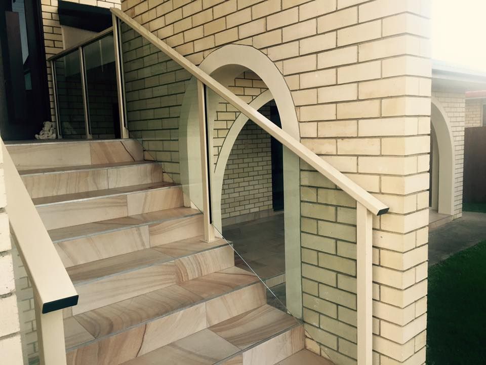 A Set of Stairs Leading Up to a Brick Building — DC Fencing In Wondunna, QLD