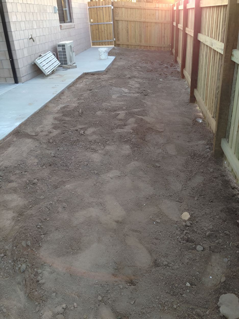 A Dirt Path Leading to a Wooden Fence in a Backyard — DC Fencing In Wondunna, QLD