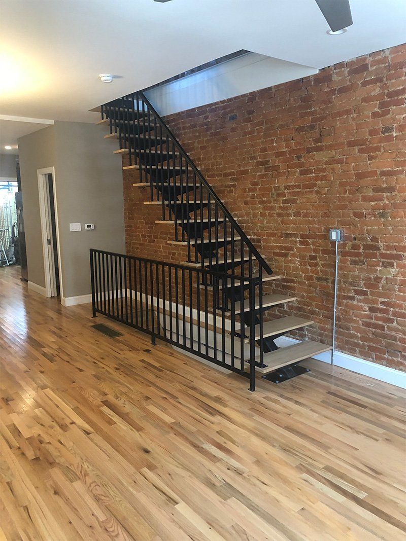 Black Stairs with Metal Railings — Philadelphia, PA — Family & Friends Builders LLC