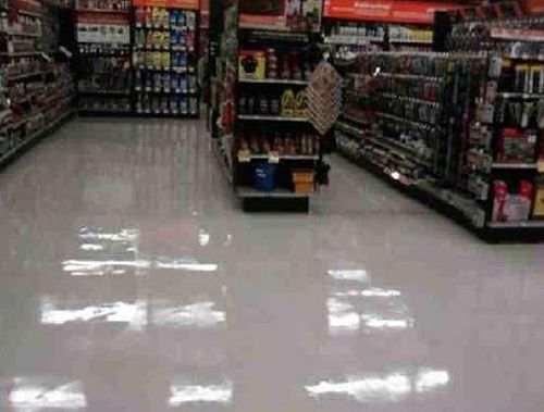 A person is standing in the middle of a store.