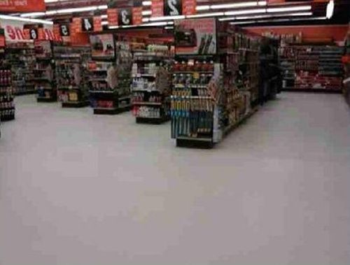 The inside of a grocery store with lots of shelves