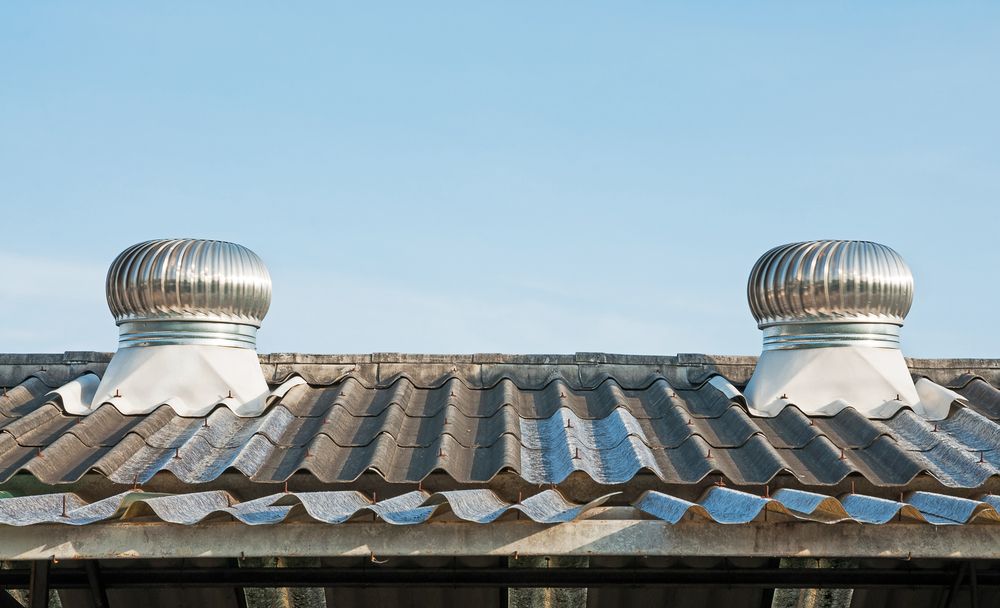 Two Silver Whirlybirds on a Gray Roof — Boostn Pty Ltd in Maryborough, QLD