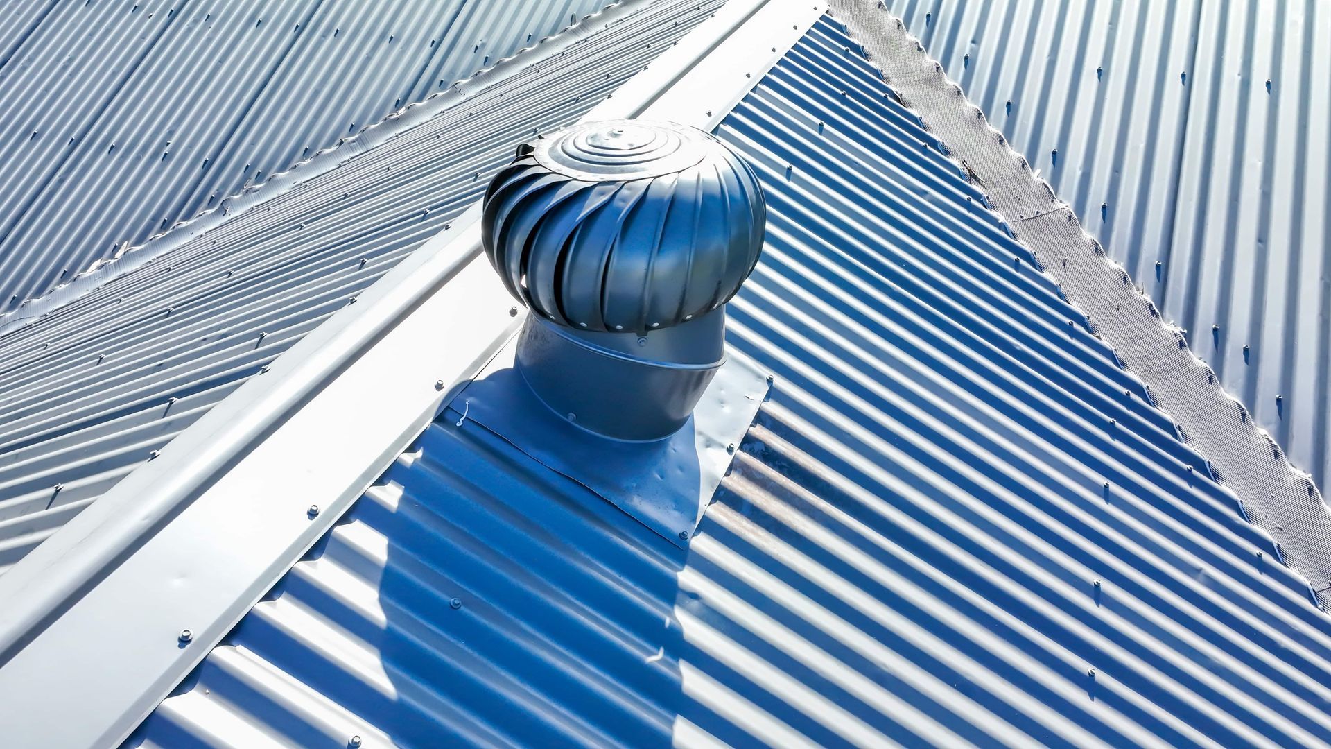 Metallic Roof With a Spinning Turbine Vent — Boostn Pty Ltd in Noosa, QLD