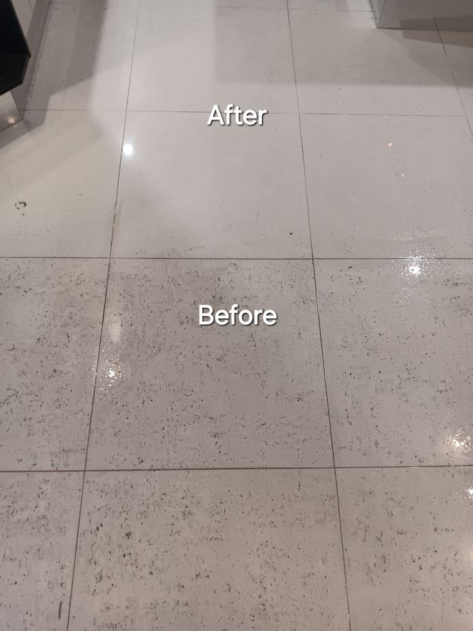 Professional Cleaner Cleaning Grout With A Brush Blade And Foamy Soap — Premium Carpet Cleaning In Trinity Park, QLD