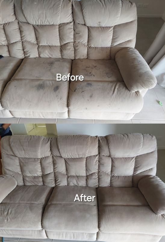 A Person Is Using a Vacuum Cleaner to Clean a Carpet in A Living Room — Premium Carpet Cleaning In Trinity Park, QLD