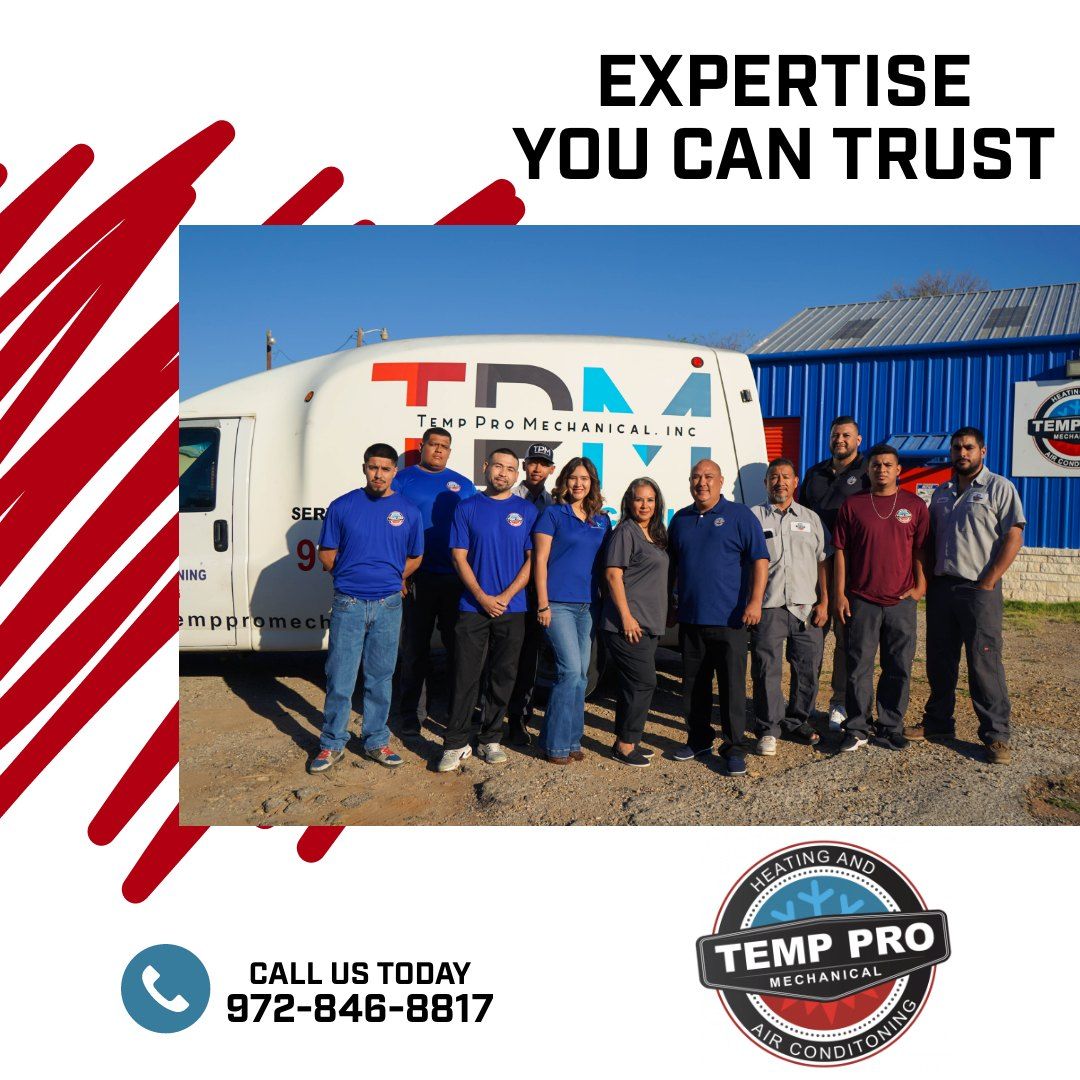 A group of people standing in front of a tdm truck